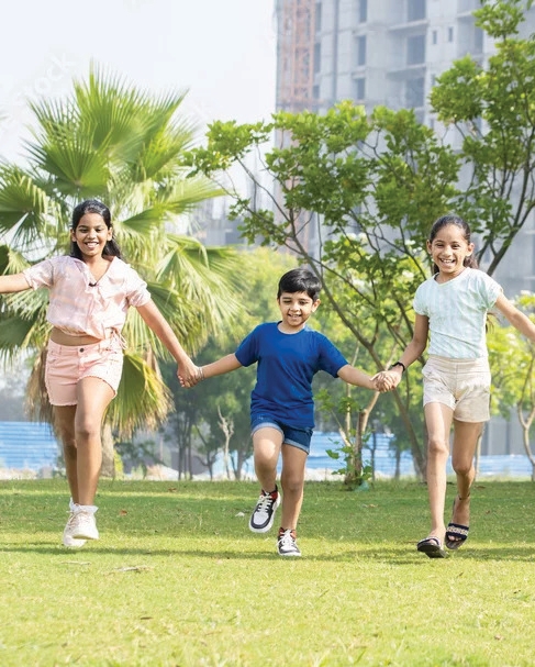 Children running on green field in Rose Garden City